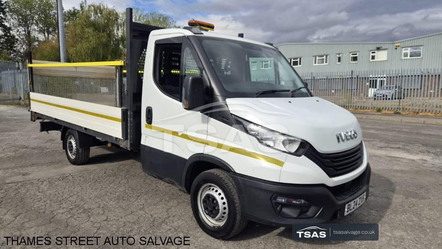 White Iveco Daily tipper in the yard